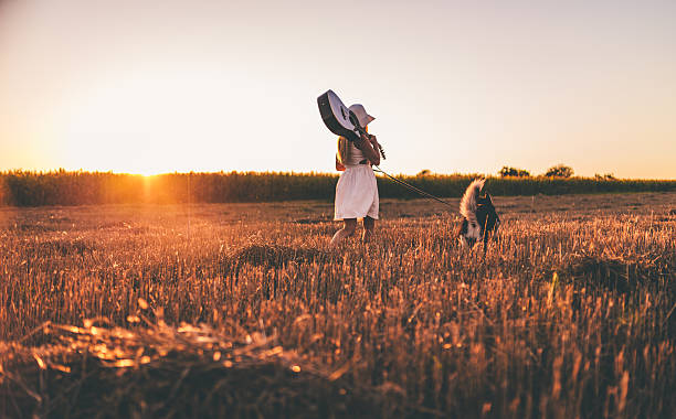 istock Enjoying sunset with dog and guitar 626512254