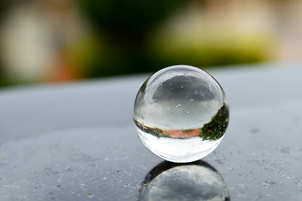istock Glass ball reflecting a landscape 626512474