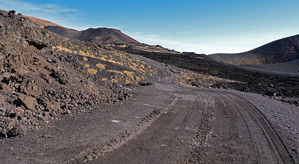 istock Back dirt road over the Mount Etna volcano 626512662