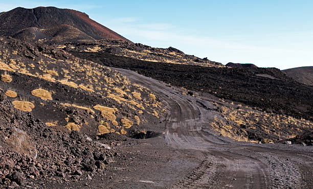 istock Back dirt road over the Mount Etna volcano 626512688