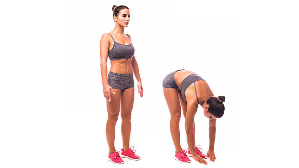 istock young woman doing exercise Standing Toe Touches 626513296