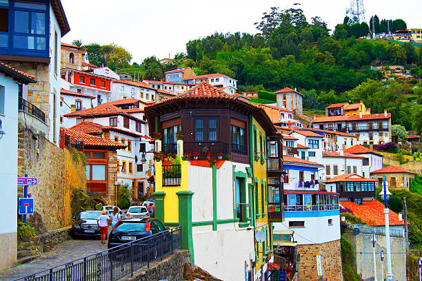 People walking the streets during the day Lastres, Spain Lastres, Spain - August 9, 2014: People walking the streets during the day Lastres, Spain ballast water stock pictures, royalty-free photos & images