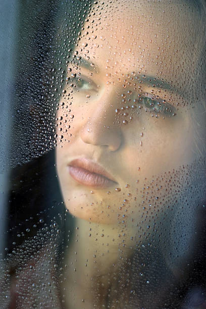 istock The girl behind glass 626513830