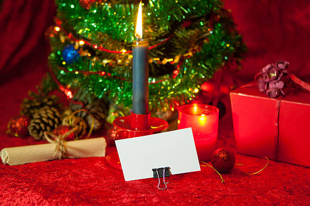 istock Christmas Tree with paper and burning candle 626514302