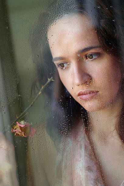 istock The girl behind glass 626515104