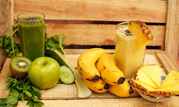 istock Fresh vegan green and yellow smoothies 626515384