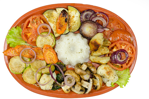 mixed grilled vegetables on a clay plate