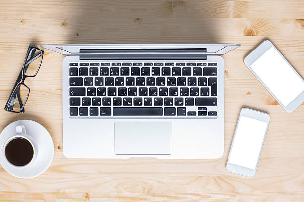 istock Laptop and cellphones on desktop 626522478