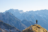 Alpinist Enjoying the View Over the Mountains in the Alps