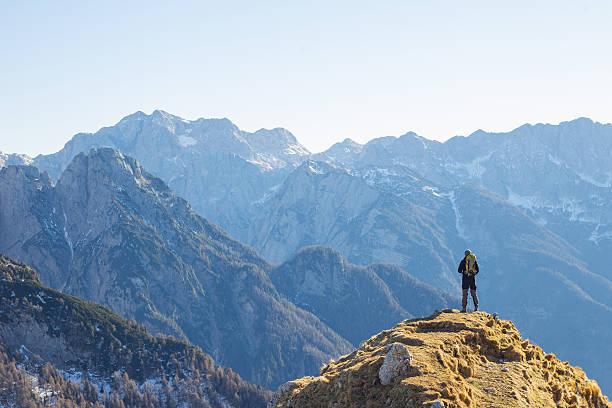 alpinist enjoying the view over the mountains in the alps - mountain mountain range people snow imagens e fotografias de stock