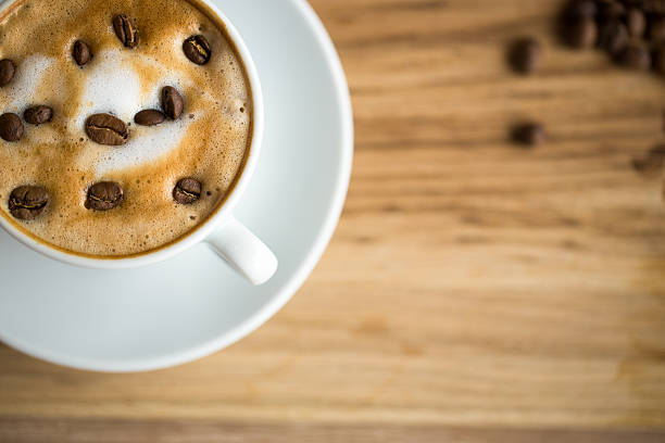 istock close up Latte Art cup cafe with coffee beans 626523580