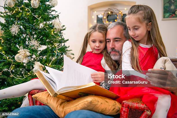 Father Reading Fairy Tales To His Daughters Stock Photo - Download ...