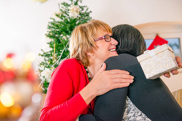 istock Friends Exchanging Christmas Presents 626523702