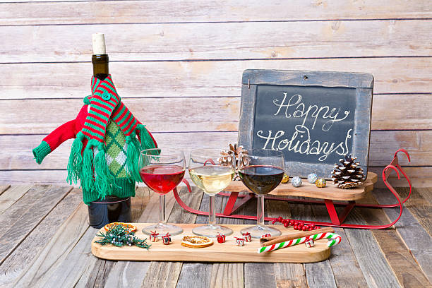 istock Holiday wine flight with chalkboard sign and decorations 626524032
