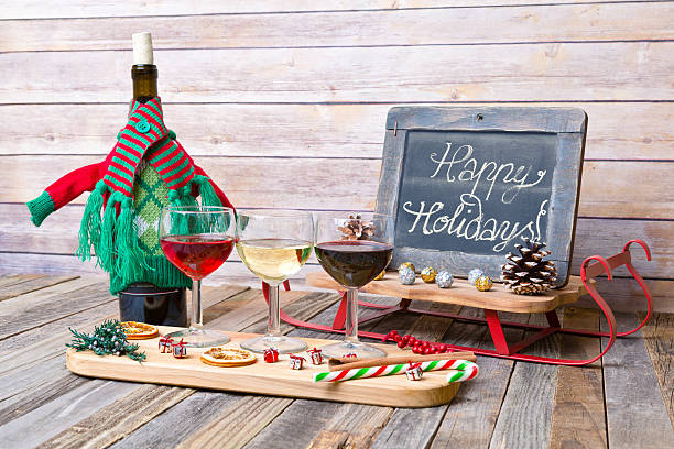 istock Holiday wine flight with chalkboard sign and decorations 626524076