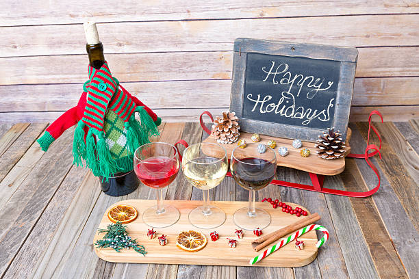 istock Holiday wine flight with chalkboard sign and decorations 626524100
