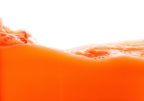 Tomato juice splash isolated on white background. Healthy fresh drink, wave with drop