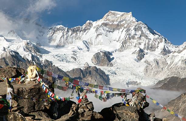 istock mount Gyachung Kang 7952m with prayer flags 626537018