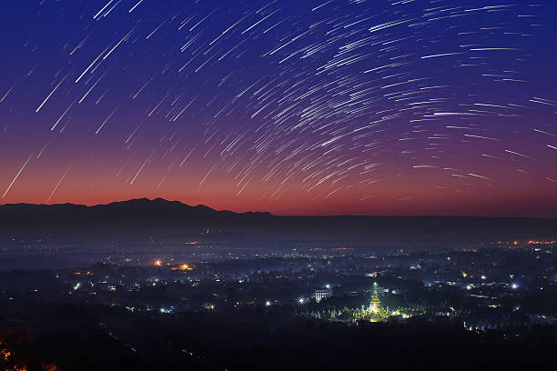 Beautiful scenery of Mandalay hill Beautiful scenery during the twilight before the sun rise and star trail of top view at Mandalay hill in Myanmar. is a beautiful location and very popular for tourists and photographer mandalay photos stock pictures, royalty-free photos & images