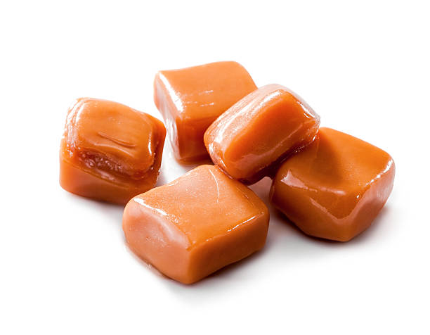 istock slightly melted caramel candy close-up isolated on white background 626538102