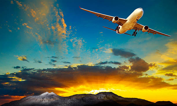 istock plane flying against beautiful sun rising sky for traveling them 626539978