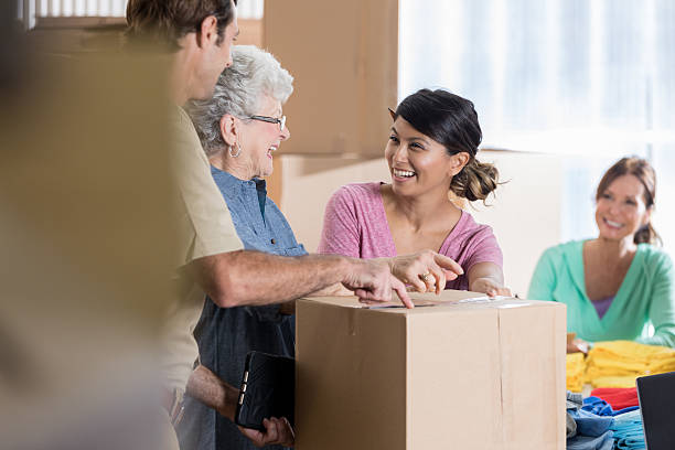 istock Business partners pack up merchandise in warehouse 626541264