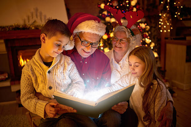 istock Christmas- family reading book 626542794