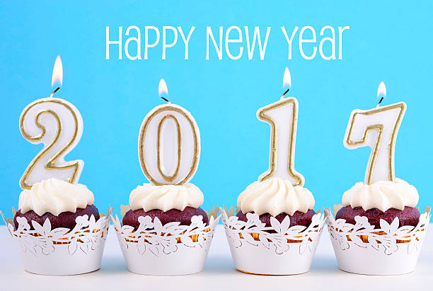 istock Happy New Year cupcakes with 2017 candles 626542840