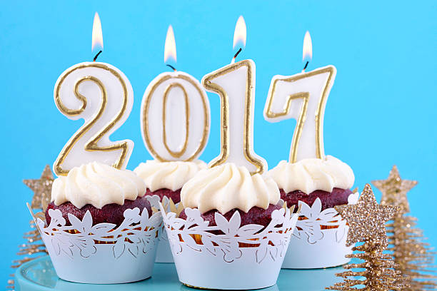 istock Happy New Year cupcakes with 2017 candles 626543104