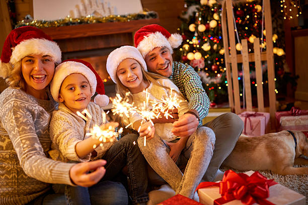 istock family with sparklers celebrating Christmas 626543172