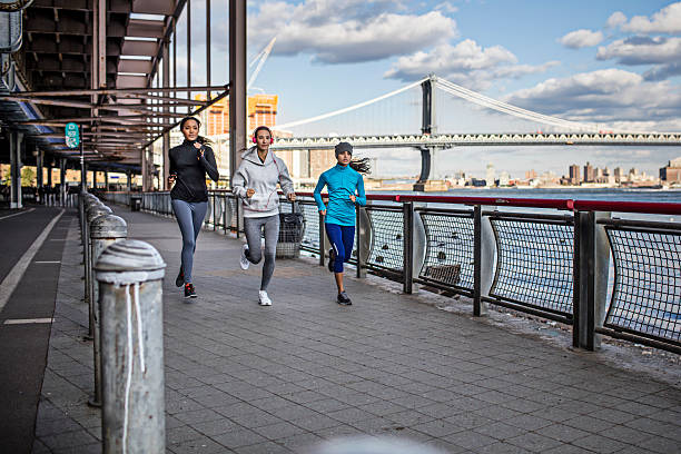 istock Fit young women running on promenade 626543564
