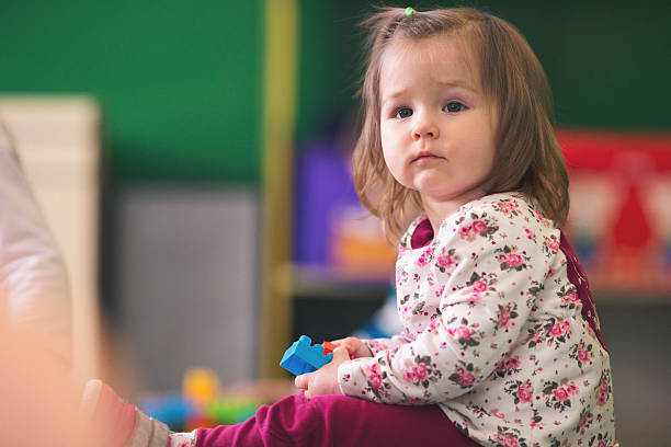 istock Baby girl playing on the floor 626543616