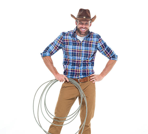 istock Cheerful cowboy holding lasso 626543824