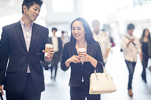 business people commuting to work - rush hour commuter on the phone tokyo prefecture imagens e fotografias de stock