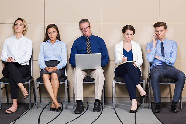 istock Men and Women Sitting and Waiting for Interview 626545474