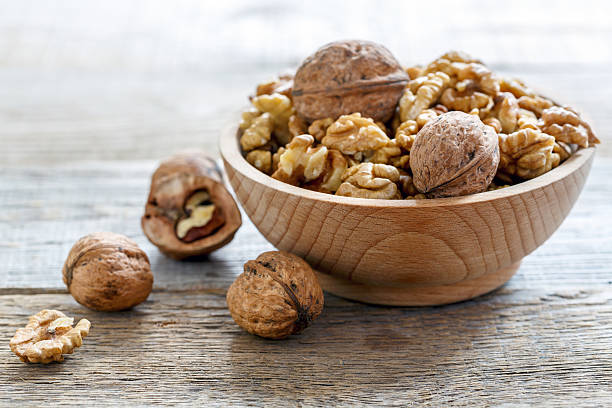 istock Walnuts in a wooden bowl. 626546934