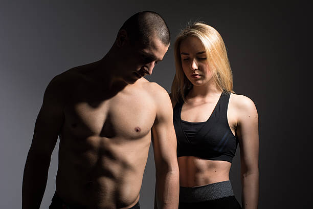 istock Man with a naked torso and girl 626551202