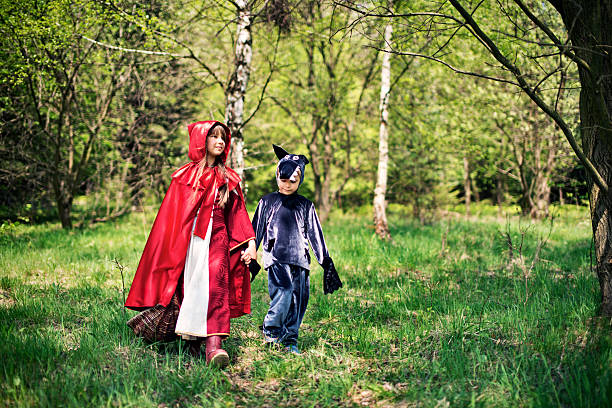 istock Little Red Riding Hood walking with Big Bad Wolf 626552328