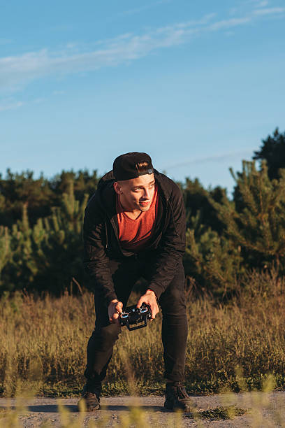 istock Excited man running drone outdoor, free space 626552794