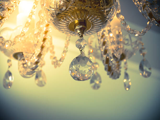 istock Quiet room chandelier,cross processed colors. 626553376