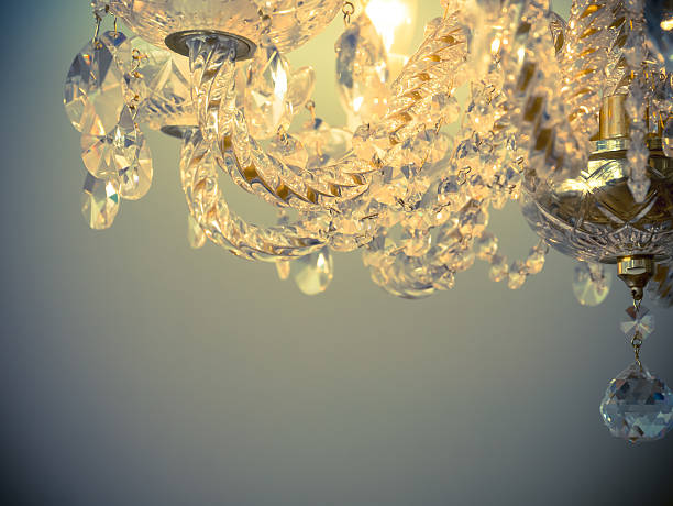istock Quiet room chandelier,cross processed colors. 626553814