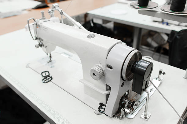 istock Close-up of sewing machine in workshop 626564194