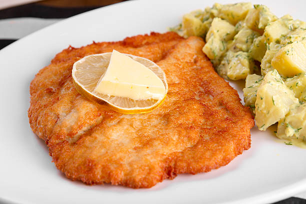 istock Homemade Breaded Orange German Weiner Schnitzel with Potatoes, Butter. 626565228