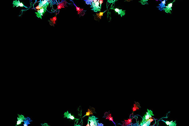 istock christmas lights border on black background 626565924