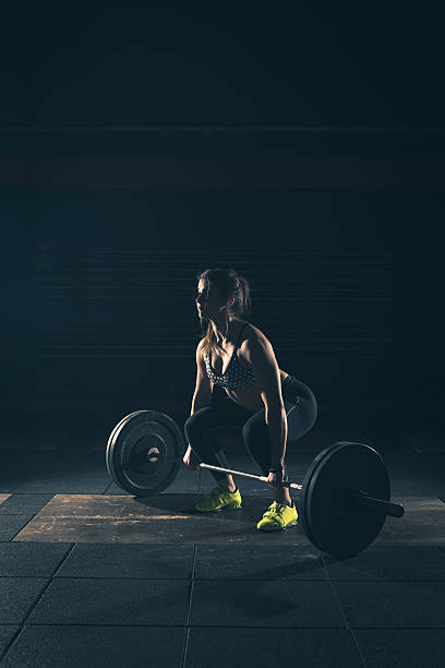 weightlifting strong woman on a gym stock photo