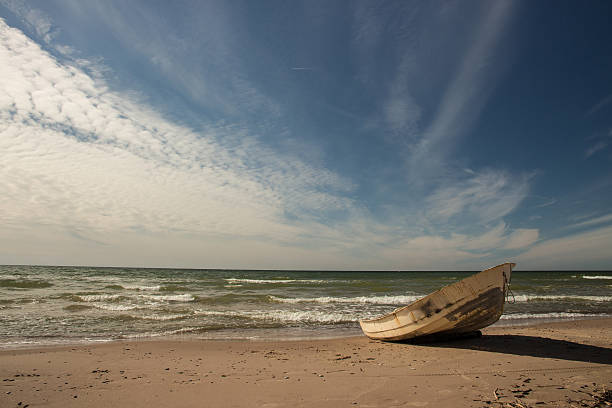 istock Stunning sky over a fishing boat on Baltic beach 626569330