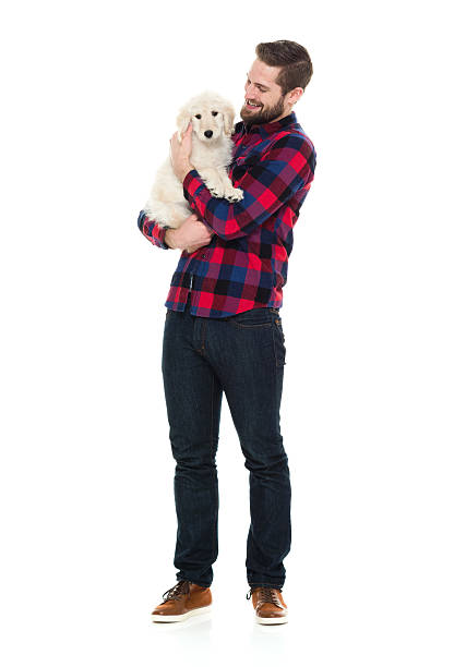 istock Smiling man embracing with his dog 626569390