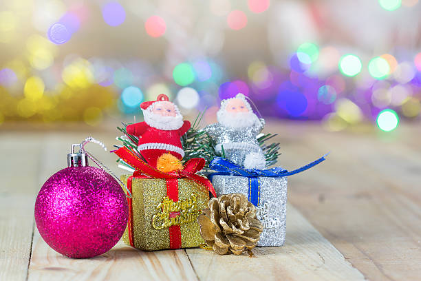 istock Christmas decoration on wooden table with blurred light background 626569816