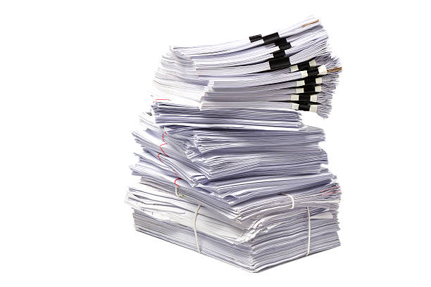 istock Stack of business papers isolated on white background 626570752