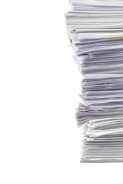 istock Stack of business papers isolated on white background 626571686